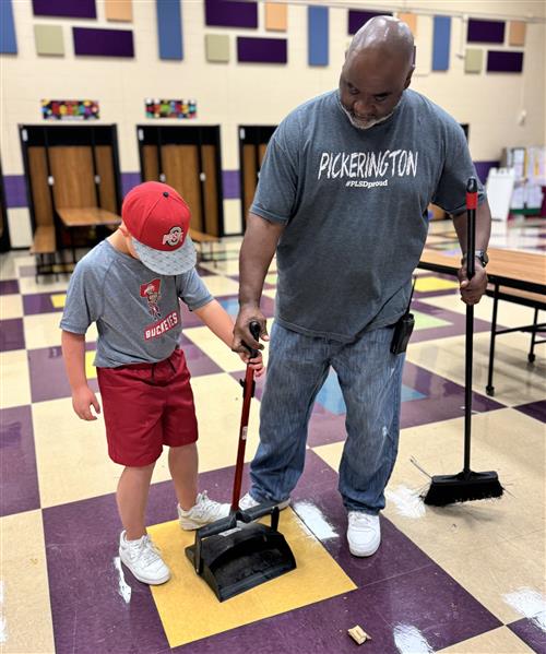 custodian with student